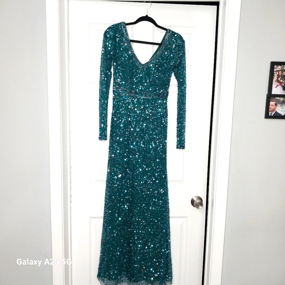 Dark green Aidan Mattox, sequin, long sleeve formal dress with beaded Detailing.